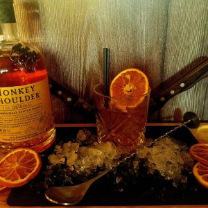 Monkey shoulder display with a nice cocktail