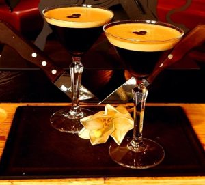 Espresso Martini x2 cocktail on a board and knife